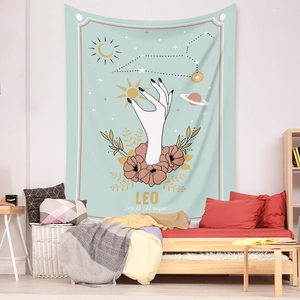Detail of Leo zodiac wall tapestry featuring golden sun and floral patterns in a cozy bedroom