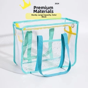 Detailed view of spacious transparent PVC beach bag with yellow and cyan straps