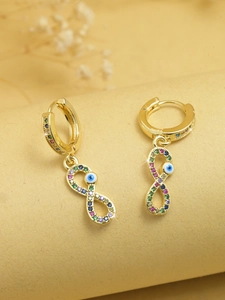 Detailed shot of golden infinity hoop earrings with blue evil eye and colorful zircons