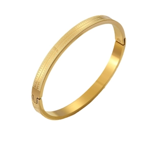 Bracciale rigido in acciaio al titanio dorato con motivo a dente di sega inciso