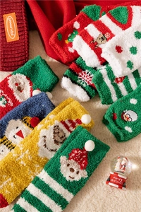 Detailed view of plush Christmas socks in festive colors with warm winter textures