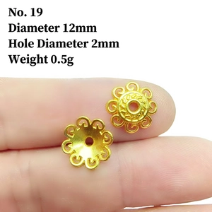 Detailed macro view of 12mm golden hollow flower bead caps for DIY jewelry making