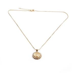 Gold plated necklace with zircon pavé round religious medallion pendant on white background