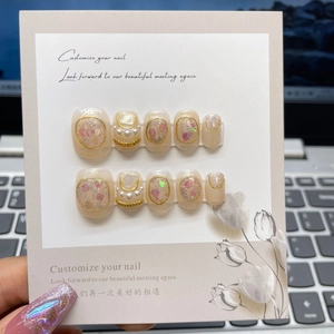 Handmade Baroque pearl press-on nails with gold chains and glitter in nude pink