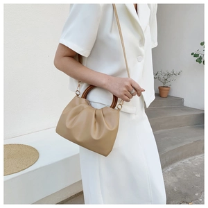 Fashionable khaki pleated cloud bag with wooden ring handle and fine leather strap