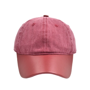 Classic red washed cotton baseball cap with retro leather brim and six-panel structure