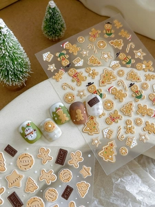 Close-up of 5D embossed Christmas gingerbread man and snowflake nail art stickers