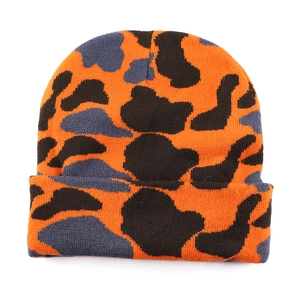 Winter leopard print knitted beanie hat in orange and black for warm outdoor fashion