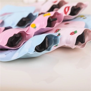 Cute PVC mini hot water bottles with cartoon fruit patterns in pink and blue colors