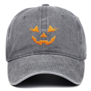 Detail of orange Halloween pumpkin embroidery on dark grey washed cotton baseball cap
