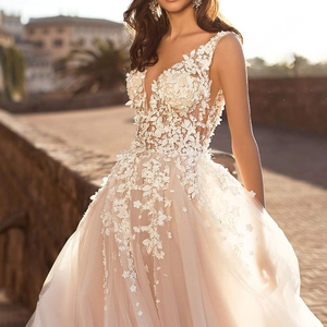 Elegant deep V-neck sleeveless bridal gown with 3D floral lace and layered tulle skirt