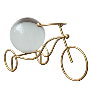 Golden metal tricycle art statue with clear crystal ball for home and office desk decor