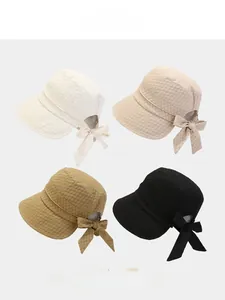 Detailed close-up showing the unique honeycomb embossed texture and large bow on sun hats