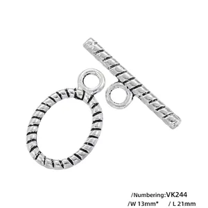 Macro detail of vintage style spiral texture silver plated toggle clasp measuring 13x21mm