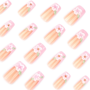 3D pink flower press-on nails with white floral relief and green leaf details