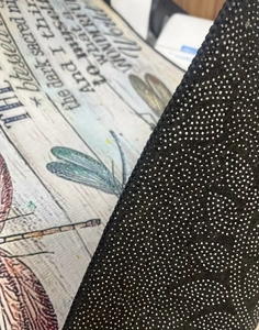 Detail view of anti-slip back and dragonfly print on kids parking play mat rug