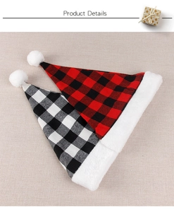 Detail of red and black checkered Christmas hats with plush white trim on rustic fabric