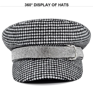 Detail showing houndstooth newsboy cap with silver rhinestone band and metal buckle