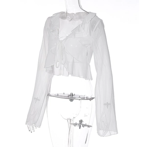 Close-up of white sheer chiffon top with ruffle trim, V-neck tie, and flared sleeves