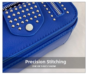 Macro view of blue lychee leather bag featuring silver studs and precision stitching