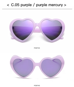 Close-up of heart-shaped purple sunglasses with purple mercury lenses in a positive view