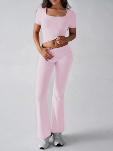 Detailed view of pink cotton blend crop top and flared pants with ribbed texture finish