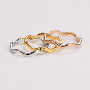 Three-piece set of wave stackable rings in silver, gold, and rose gold finish