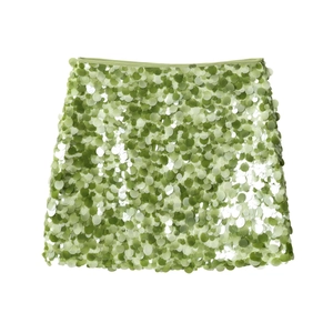 Detail showing high-quality green sequins and layered texture on midi skirt