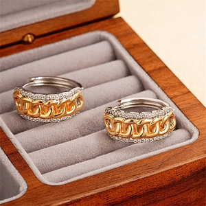 Golden Cuban link hoop earrings with pavé zircon borders in a premium velvet jewelry box