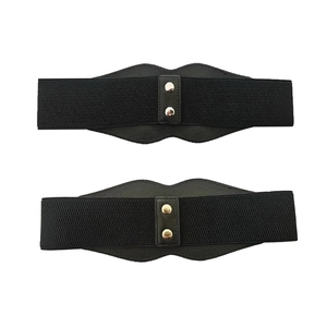 Close-up of black elastic waist cincher with leather lip-shaped buckle and metal rivets