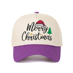 Close-up of Merry Christmas embroidery on a cream and purple color-block baseball cap