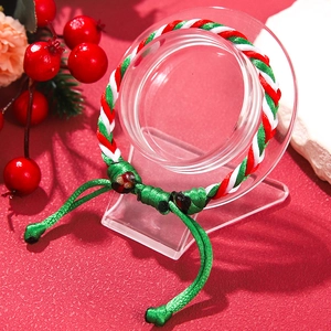 Adjustable Christmas woven bracelet in red, white and green spiral festive design