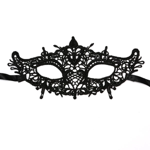 Close-up of elegant black lace masquerade mask with intricate baroque embroidery details