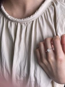 Minimalist 925 sterling silver open ring with an oval white gemstone on a silver band