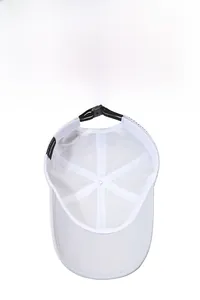 Detail of white sports cap showing breathable mesh holes and adjustable back buckle
