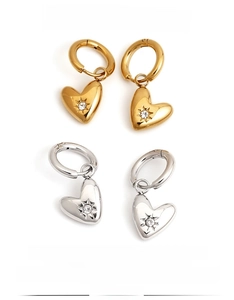 Detail of heart hoop earrings with starburst zircon in gold and silver finish