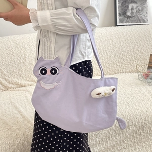 Detail of cute cat-shaped lavender canvas tote with white plush paws and fine embroidery
