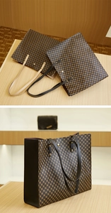 Macro detail of tote bag with geometric circle pattern and golden rivet accents