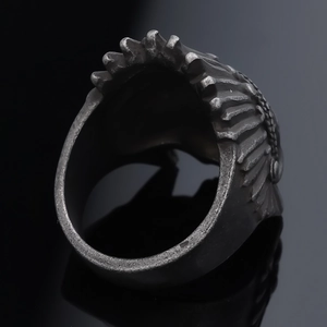 Vintage oxidized stainless steel skull ring with detailed feather texture engraving