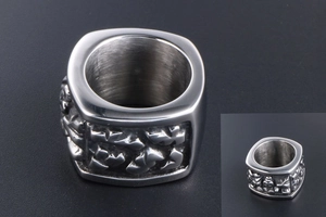 Macro view of industrial silver titanium steel square ring with irregular side relief detail
