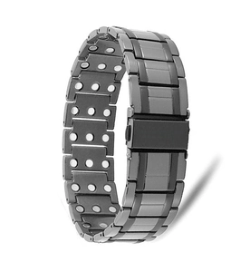 Detailed macro view of magnetic steel therapy bracelet with double row magnets and folding clasp