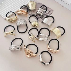 Minimalist metallic geometric hair ties in gold and silver with various textures