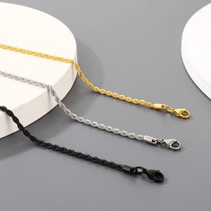 Detailed view of twisted rope chains in gold, silver, and black with lobster clasps