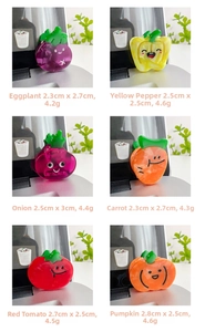 Close-up of cute cartoon vegetable acetate hair claws featuring eggplant and tomato designs