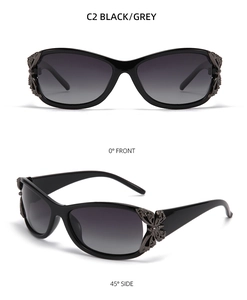 Detail of Y2K polarized sunglasses with metal butterfly hinge and grey gradient lenses