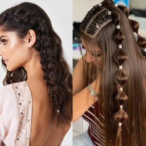 180pcs gold and silver dreadlock cuffs and hair rings shown on braided hairstyles