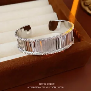 Silver striped open cuff bangle with double row pavé zircons in a jewelry box