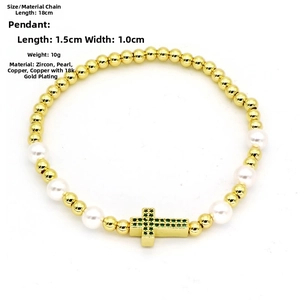 Detail view of 18k gold-plated copper bracelet with green zircon cross and white pearls