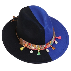 Detail of wool felt fedora with bohemian band and shell tassel in black and blue