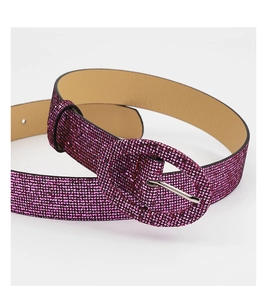 Close-up of hot pink belt with sparkling rhinestones and oval buckle for women